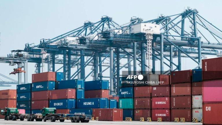 Cargo containers are stacked at the Jakarta International Container Terminal in Tanjung Priok Port, Jakarta, on August 7, 2025, as the United States begins enforcing a new 19 percent tariff on Indonesian imports. - AFP