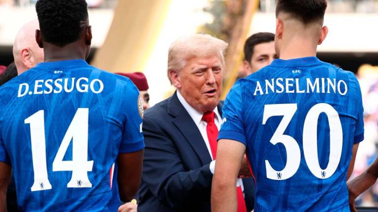 U.S. President Donald Trump presents Chelsea’s Aaron Anselmino with a medal after Chelsea won against Paris St Germain in the FIFA Club World Cup final, at the MetLife Stadium in East Rutherford, New Jersey, U.S., July 13, 2025- REUTERS
