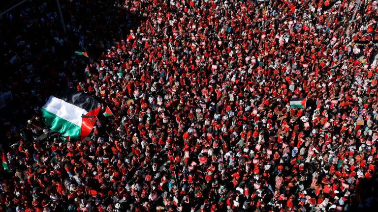 Demonstrators carry signs and Palestinian flags as they take part in the “Red Line for Gaza” demonstration, protesting against conditions in Gaza and demanding that the Belgian government imposes sanctions against Israel, in Brussels, Belgium, September 7, 2025. - REUTERS/Yves Herman