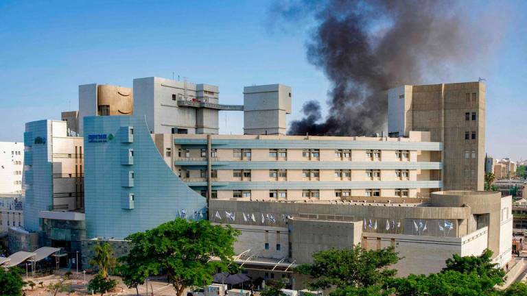 Smoke billows from a building at Soroka Hospital in Beersheba in southern Israel following an Iranian missile attack - AFPPIX