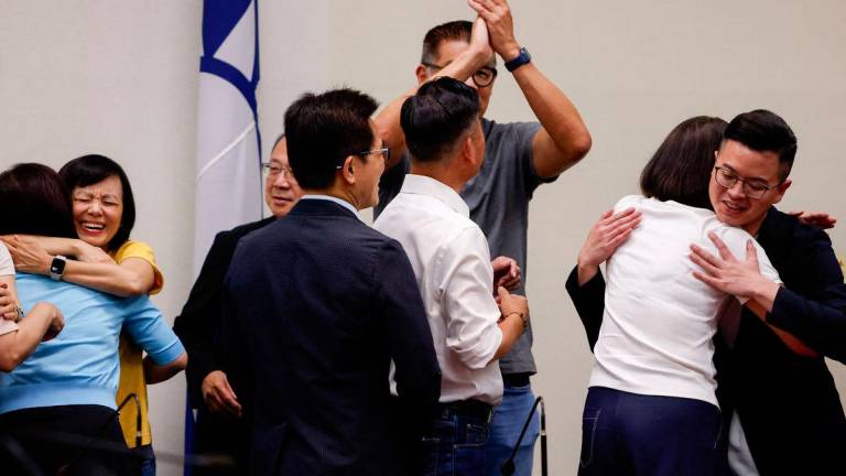 Kuomintang (KMT) lawmakers celebrate after the results of the recall election in Taipei ,Taiwan July 26, 2025 - REUTERSPIX