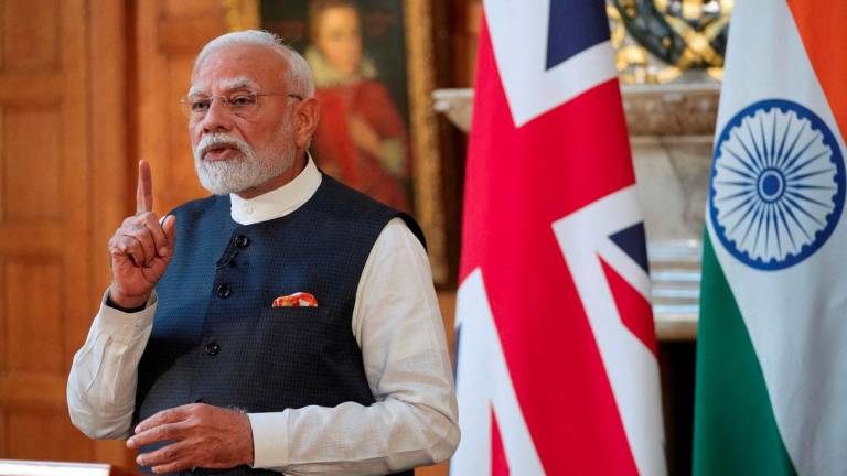Prime Minister Narendra Modi of India gestures during a press conference with Britain's Prime Minister Keir Starmer (not pictured) after signing a free trade agreement at Chequers near Aylesbury, England, Thursday, July 24, 2025. - Kin Cheung/Pool via REUTERSPIX