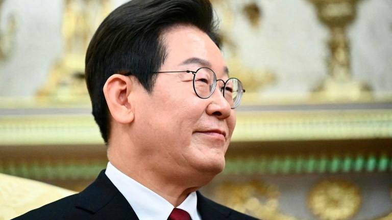 South Korean President Lee Jae Myung looks on during a bilateral meeting with US President Donald Trump in the Oval Office of the White House in Washington, DC, on August 25, 2025. - Mandel NGAN / AFP