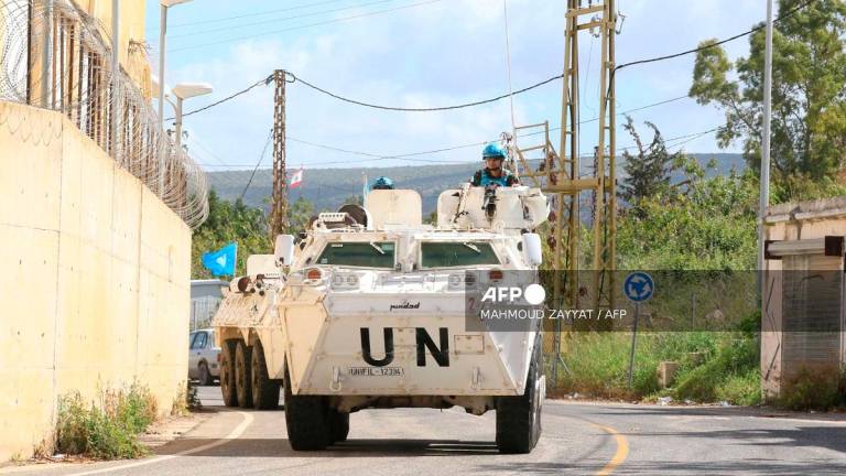 Members of the United Nations peacekeeping force in Lebanon (UNIFIL) patrol the road near the border with Israel in the southern Lebanese coastal town of Naqura on March 19, 2025. - Mahmoud ZAYYAT / AFP)