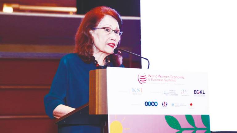 Halimah delivering her address at the 2025 World Women Economic and Business Summit.