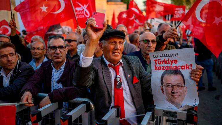 People hold Turkish flags and placards reading ‘winner Turkey’ as they take part in a demonstration against the detention of the Mayor of Istanbul, Ekrem Imamoglu, organised by the country’s main opposition, the Republican People’s Party (CHP), at Beyazid Square, in Istanbul, 07 May 2025. AFPpix