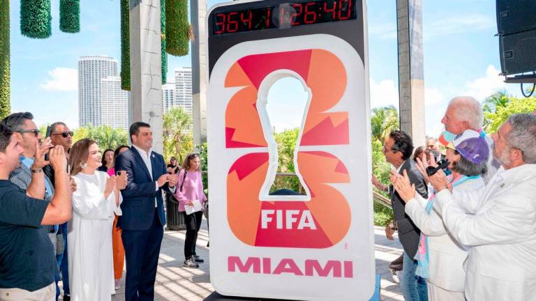 Beau Ferrari and Marc Anthony unveil the FIFA World Cup Miami Countdown Clock during the FIFA World Cup One Year Out Celebration at Perez Art Museum Miami on June 11, 2025 in Miami, Florida. AFP