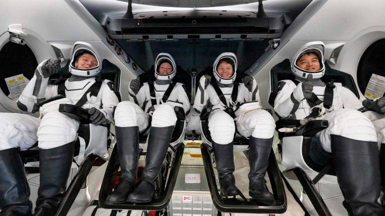 This picture provided by NASA shows, from L to R, Roscosmos cosmonaut Kirill Peskov, NASA astronauts Nichole Ayers, Anne McClain, and Japan Aerospace Exploration Agency (JAXA) astronaut Takuya Onishi inside the SpaceX Dragon Endurance spacecraft onboard the SpaceX recovery ship Shannon shortly after having landed in the Pacific Ocean off the coast of San Diego, California, on August 9, 2025. - AFP PHOTO / NASA / Keegan Barber