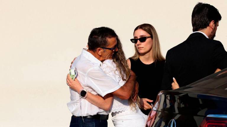 Rute Cardoso is embraced as she arrives on the day of the funeral ceremony of her late husband Liverpool’s Portuguese soccer player Diogo Jota and his brother Andre Silva, who died in a car crash near Zamora, Spain, near the Chapel of the Resurrection, in Gondomar, Portugal, July 5, 2025- REUTERS