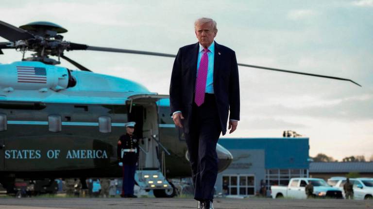 U.S. President Donald Trump walks to board Air Force One as he departs for Washington at Morristown Municipal Airport in Morristown, New Jersey, U.S., September 14, 2025. REUTERS/Ken Cedeno
