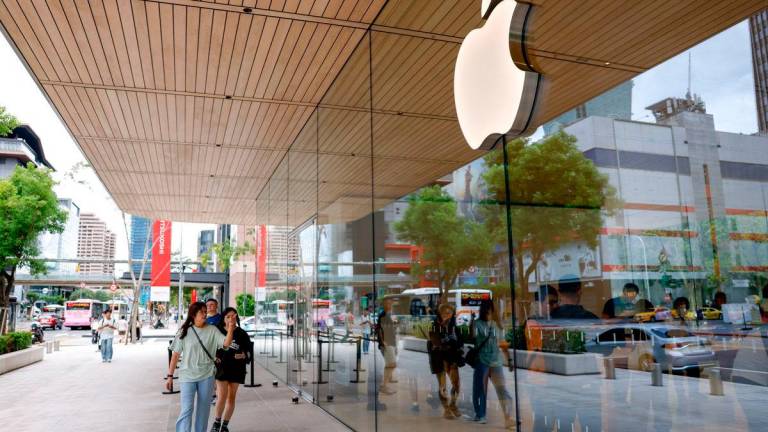For representational purposes only: People walk pass an Apple Store in Taipei, Taiwan, September 19, 2025. REUTERS/Ann Wang