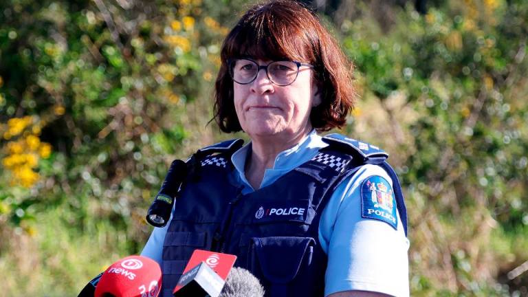 New Zealand Police Acting Deputy Commissioner Jill Rogers reacts during a media briefing at a roadblock where a police shootout occurred near the town of Piopio, located in New Zealand’s Waikato region on September 8, 2025. - DJ MILLS / AFP