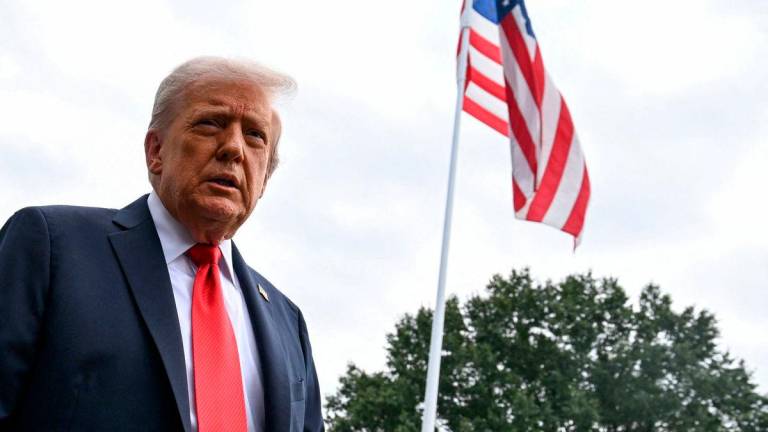 FILE PHOTO: U.S. President Donald Trump talks to the press on the South Lawn of the White House, in Washington, U.S., September 7, 2025. REUTERS/Annabelle Gordon/File Photo