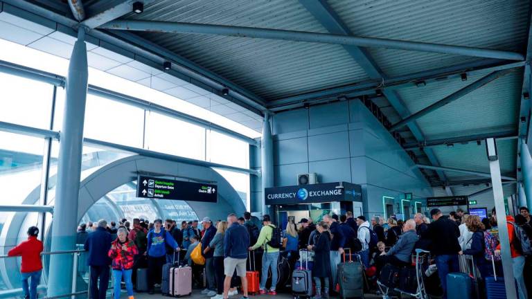 People queue to enter at Dublin Airport’s Terminal 2, which has been evacuated as a safety precaution, in Dublin, Ireland, September 20, 2025. REUTERS/Clodagh Kilcoyne
