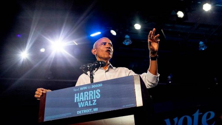 Former U.S. President Barack Obama speaks to the crowd during a campaign event for Democratic presidential nominee and U.S. Vice President Kamala Harris, during the first week of early voting in Detroit, Michigan. REUTERSPIX