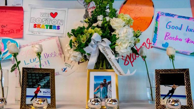 Sympathy flowers sit on a table alongside photos of people lost on American Airlines flight 5342 at the Skating Club of Boston in memory of the six Boston area skaters and their family members and coaches, in Norwood, Massachusetts on January 30, 2025. Pix by Joseph Prezioso / AFP