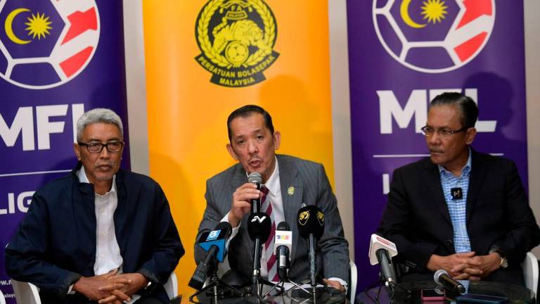 FAM president Datuk Mohd Joehari Mohd Ayub (in the middle) during a press conference on May 30. BERNAMApix