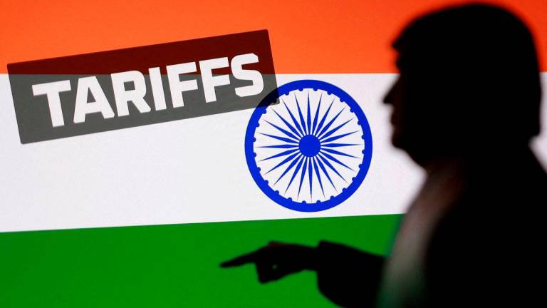 FILE PHOTO: Indian flag, 3D-printed miniature model depicting U.S. President Donald Trump and the word “Tariffs”, are seen in this illustration taken August 27, 2025. REUTERS/Dado Ruvic/Illustration/File Photo