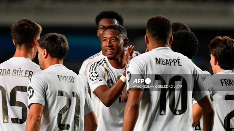 Real Madrid's French forward #10 Kylian Mbappe (R) and Real Madrid's Austrian defender #04 David Alaba (C) celebrate scoring their team's third goal during the UEFA Champions League first round day 2 football match between Kairat Almaty and Real Madrid at the Almaty Ortalyk stadion in Almaty on September 30, 2025. - AFPPIX