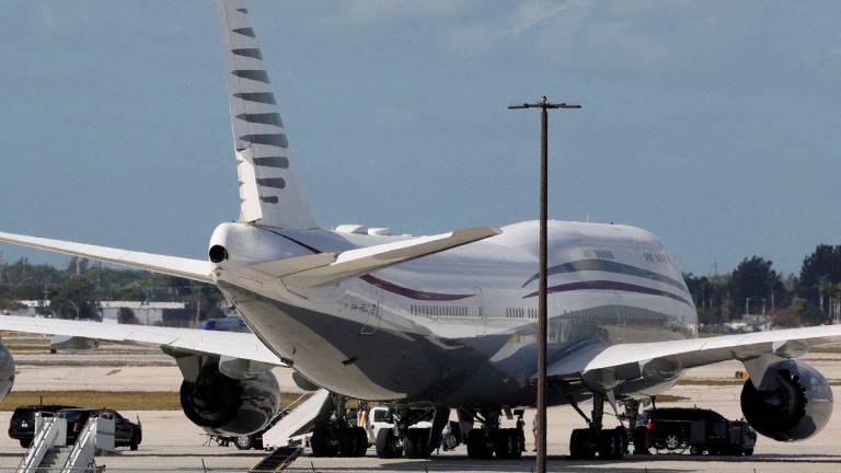 The motorcade of U.S. President Donald Trump is parked next to a 12-year old Qatari-owned Boeing 747-8 that Trump was touring in West Palm Beach, Florida, U.S., February 15, 2025. REUTERSpix
