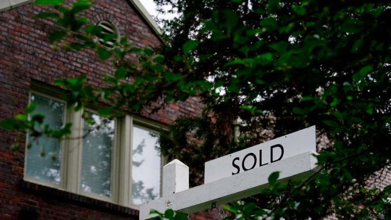 A sign is seen outside a purchased home in Washington. New home sales dropped 5.6% to a seasonally adjusted annual rate of 679,000 units last month. – Reuterspic