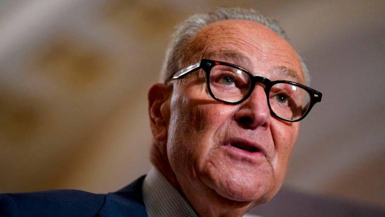 FILE PHOTO: U.S. Senate Minority Leader Chuck Schumer (D-NY) speaks to reporters as Senate Democratic leaders hold a press conference following their weekly policy lunch on Capitol Hill in Washington, D.C., U.S., September 9, 2025. REUTERS/Elizabeth Frantz/File Photo