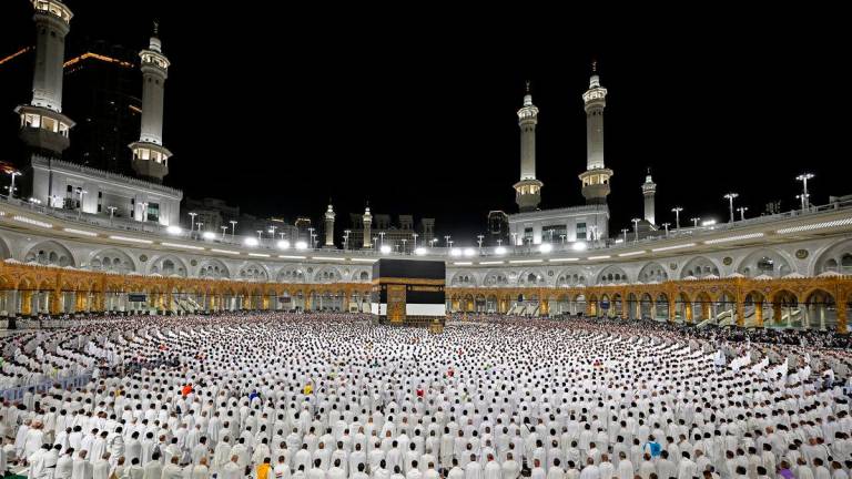 Muslims perform morning prayers in the grand mosque during the annual hajj pilgrimage in the holy city of Mecca, Saudi Arabia, June 3, 2025. Saudi Press Agency/Handout via REUTERS.