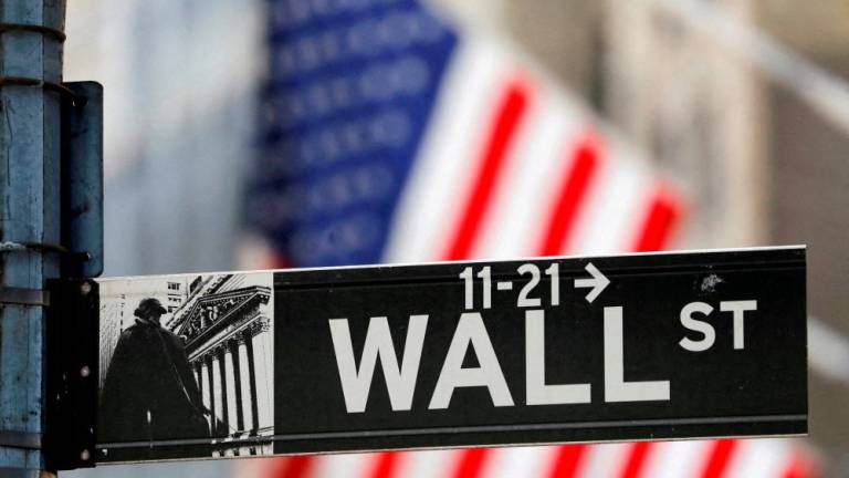 A street sign for Wall Street is seen outside the New York Stock Exchange. – Reuterspic