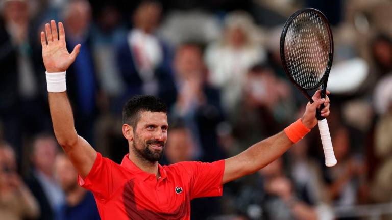 Serbia's Novak Djokovic celebrates after winning his men's singles match against US Mackenzie Mcdonald on day 3 of the French Open tennis tournament on Court Philippe-Chatrier at the Roland-Garros Complex in Paris. AFPpix