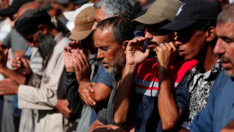 Mourners pray during the funeral of Palestinians killed overnight in Israeli attacks on a tent and on people seeking aid, according to Gaza's health ministry, at Nasser Hospital in Khan Younis, southern Gaza Strip, July 4, 2025. - REUTERSPIX
