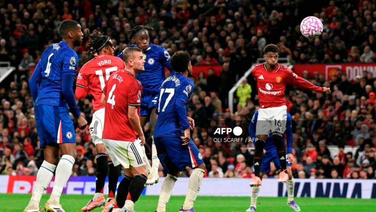 Chelsea's English defender #23 Trevoh Chalobah scores the team's first goal during the English Premier League football match between Manchester United and Chelsea at Old Trafford in Manchester, north west England, on September 20, 2025. - AFP