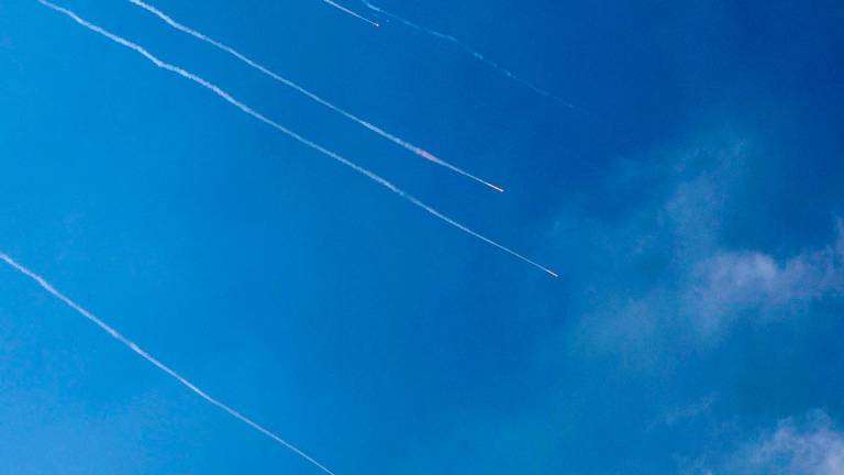 Rocket trails are seen in the sky above the Israeli coastal city of Netanya amid a fresh barrage of Iranian missiles on June 17, 2025. Israel’s military said air raid sirens sounded in several areas of the country on June 17 after identifying missiles launched from Iran, as AFP journalists reported booms over Tel Aviv and Jerusalem. - JACK GUEZ / AFP