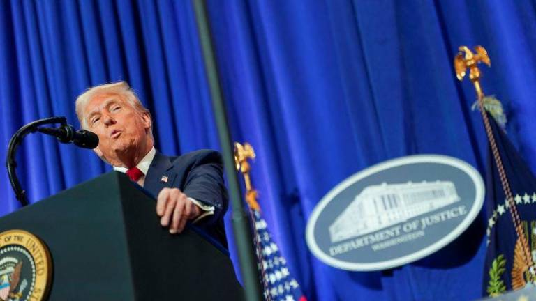 U.S. President Donald Trump speaks during his visit to the Department of Justice to address its workers, in Washington, D.C., U.S., March 14, 2025. - REUTERSPIX