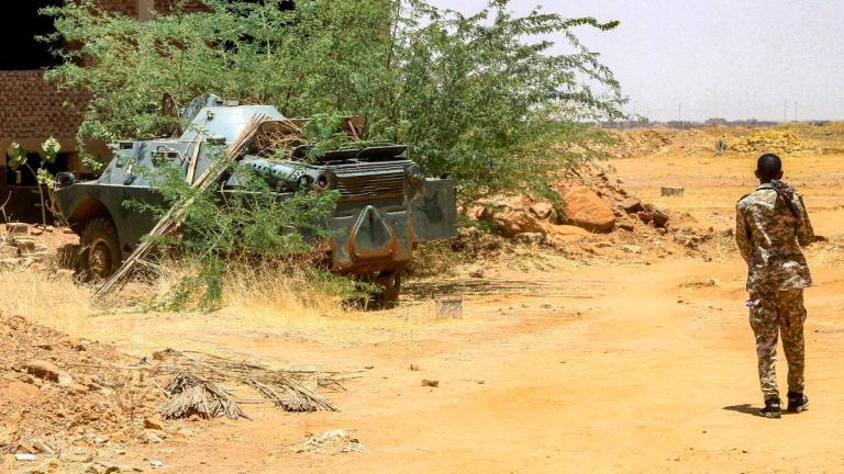 A Sudanese army soldier walks near an armoured vehicle seized after their capture of a base used by the rival Rapid Support Forces (RSF) paramilitaries after the latter group evacuated from the Salha area of Omdurman, the twin-city of Sudan’s capital, on May 26, 2025. REUTERSpix