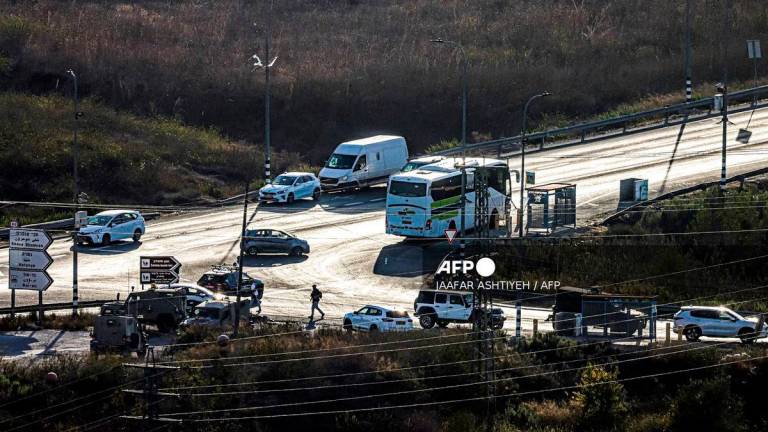 Israeli security forces restrict traffic along a road near the scene of a reported ramming attack at the Jit junction, west of Nablus in the occupied West Bank on September 28, 2025. (Photo by Jaafar ASHTIYEH / AFP)