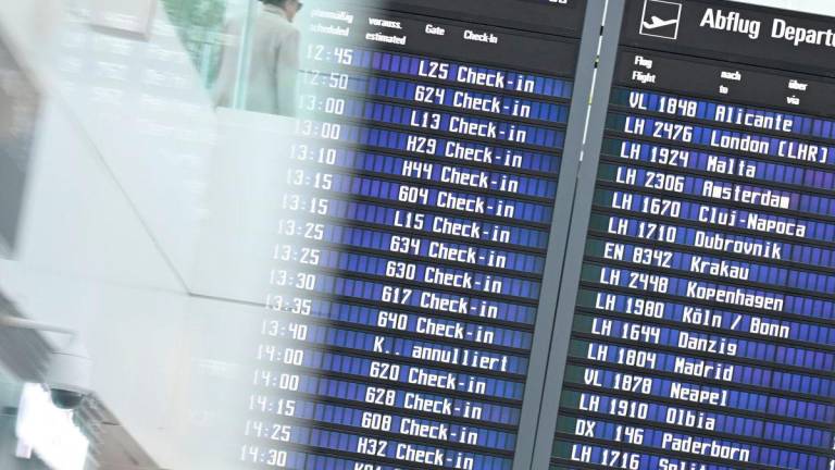The display board at the airport in Munich, Germany, October 3, 2025. REUTERS/Angelika Warmuth