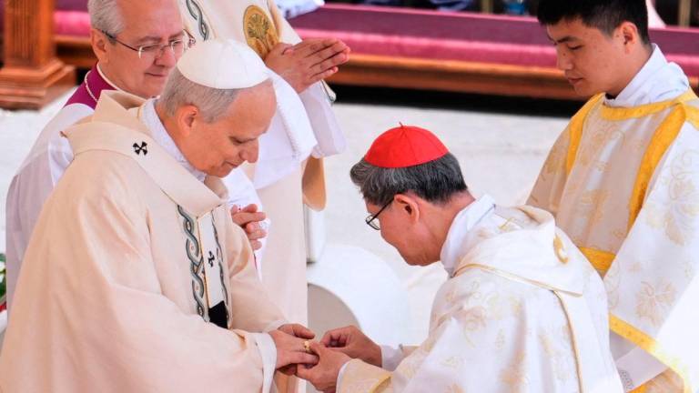 Cardinal Luis Antonio Tagle places the Ring of the Fisherman on the finger of Pope Leo XIV as the pontiff celebrates a Mass for the formal inauguration of his pontificate in St. Peter’s Square at the Vatican, Sunday, May 18, 2025. Jacquelyn Martin/Pool via REUTERSpix