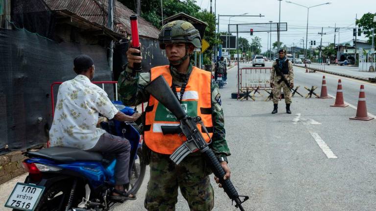 Thai authorities man a roadblock in Narathiwat during an inspection - BERNAMAPIX