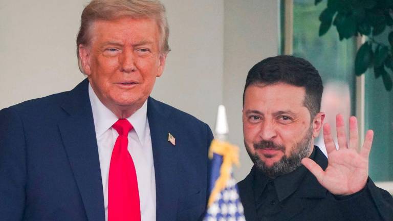 U.S. President Donald Trump meets with Ukrainian President Volodymyr Zelenskiy as he arrives at the White House amid negotiations to end the Russian war in Ukraine, in Washington, D.C., U.S., August 18, 2025. - REUTERSPIX