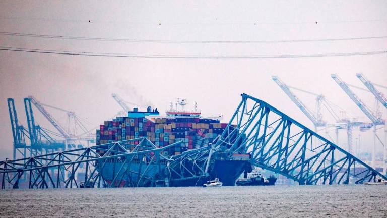 Cargo ship Dali sits in the water after running into and collapsing Baltimore’s Francis Scott Key Bridge on March 27, 2024 in Baltimore, Maryland/AFPPix