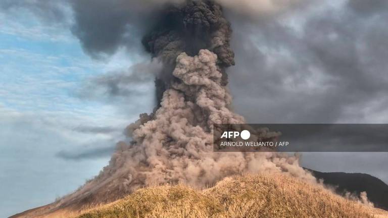 Mount Lewotobi Laki-Laki erupts as seen from Pululera village. Photo by ARNOLD WELIANTO / AFP