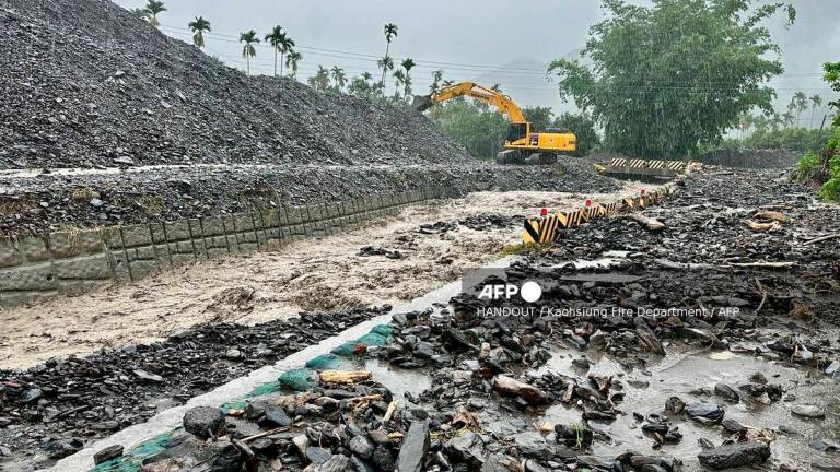 Debris after being swept away due to flooding by torrential rains in Kaohsiung. (Photo by Handout / Kaohsiung Fire Department / AFP)
