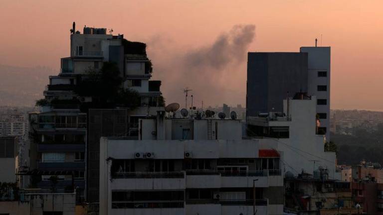 Smoke rises from Beirut southern suburbs after an Israeli strike, amid the ongoing hostilities between Hezbollah and Israeli forces, as seen from Achrafieh, Lebanon - REUTERSpix