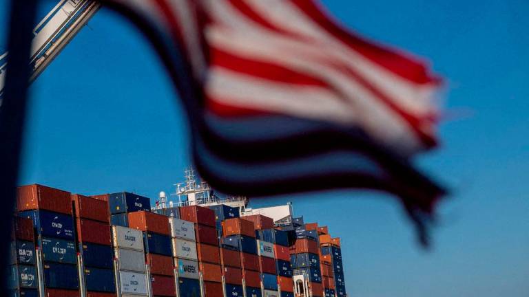 A cargo ship full of shipping containers is seen at the port of Oakland, California. Reuters