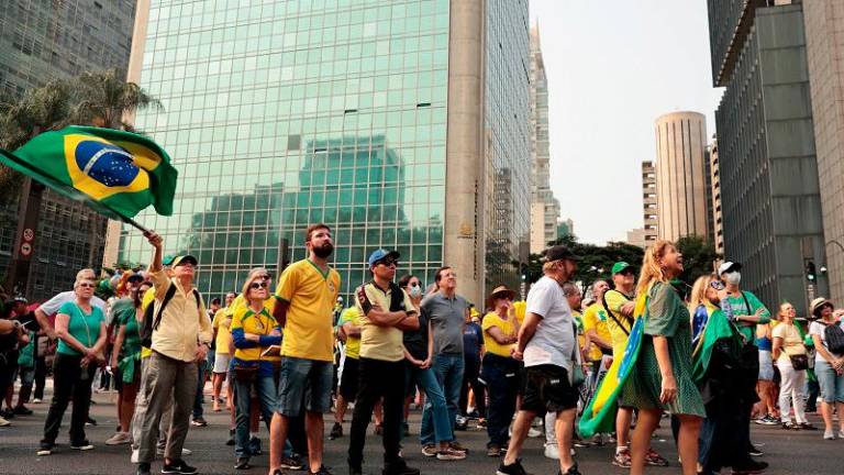 Supporters of former Brazilian President Jair Bolsonaro rally in protest against judge Alexandre de Moraes, who ordered the suspension of X social media platform, in Sao Paulo, Brazil September 7, 2024. - REUTERS/Jorge Silva