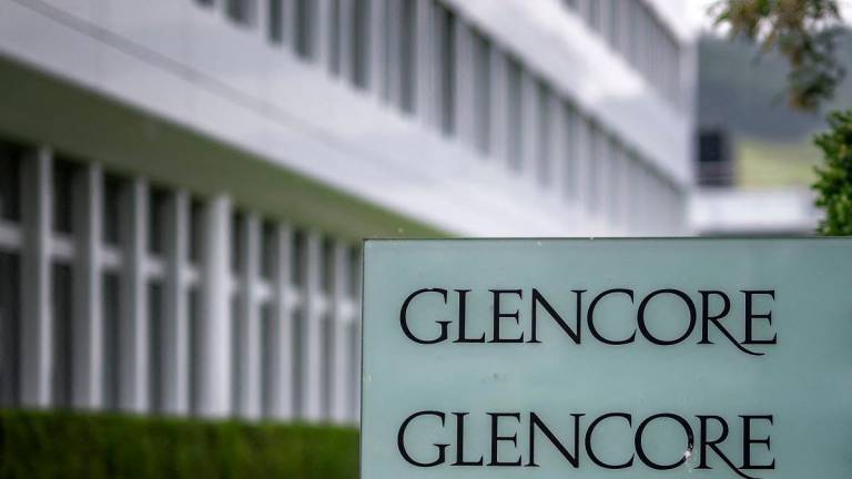 (FILES) A picture taken on May 28, 2025 shows the sign of commodity trading and mining company giant Glencore at their headquarters in Baar, central Switzerland. - Fabrice COFFRINI / AFP