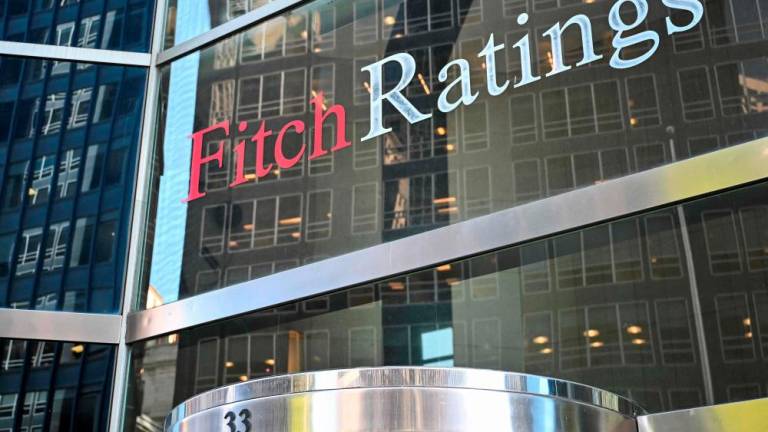 Fitch Ratings believes the global trade war will reduce US growth, push up US inflation and delay US Federal Reserve rate cuts. – AFPpic