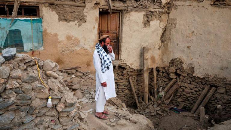 An Afghan man reacts as he stands amidst the rubble of a collapsed house after a deadly magnitude-6 earthquake that struck Afghanistan around midnight, in Dara Noor, in Jalalabad, Afghanistan, September 1, 2025. - REUTERSPIX