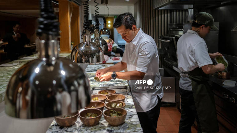 Head Chef Jorge Vallejo works in the kitchen at Quintonil restaurant in Mexico City on July 10, 2025. Behind the growing international success of a Mexican restaurant named one of world's best is a love story between two gourmets with a passion for blending traditional and contemporary flavors. Quintonil, which opened in 2012 in the upscale Mexico City neighborhood of Polanco, already boasted two Michelin stars. - AFP