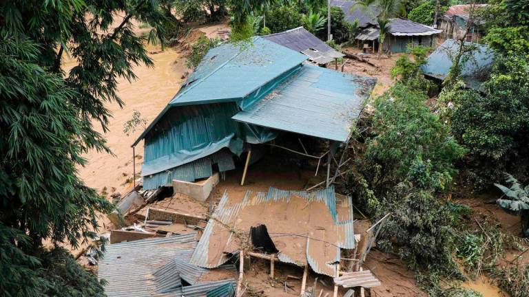 This photo taken by the Vietnam News Agency (VNA) on August 1, 2025 shows a collapsed house due to flooding in northern Vietnam’s Dien Bien province. AFP PHOTO / Vietnam News Agency